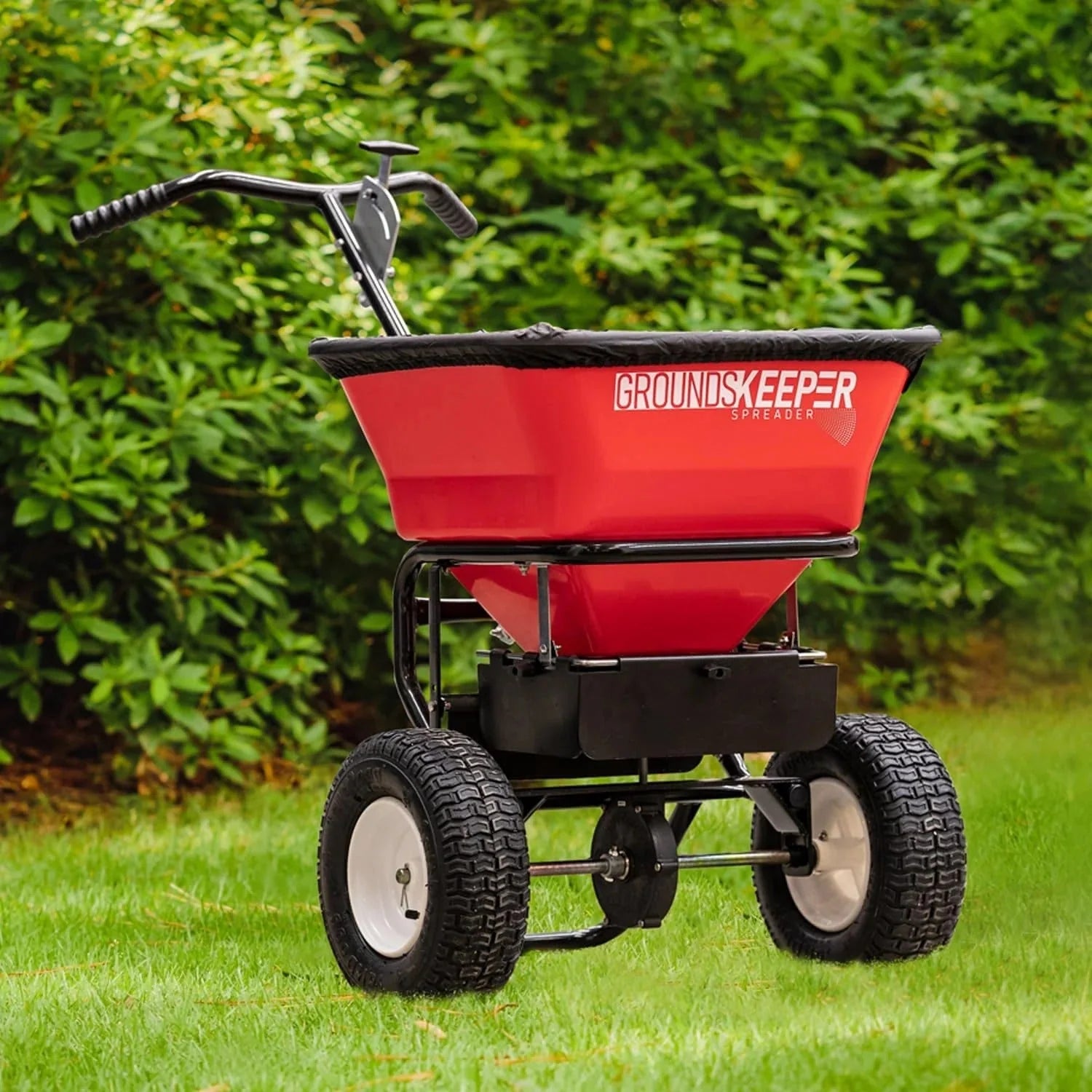 Multi-purpose push-along spreader, 100 lb capacity, versatile tool for lawn seed, salt, de-icer, fertilizer and seeds