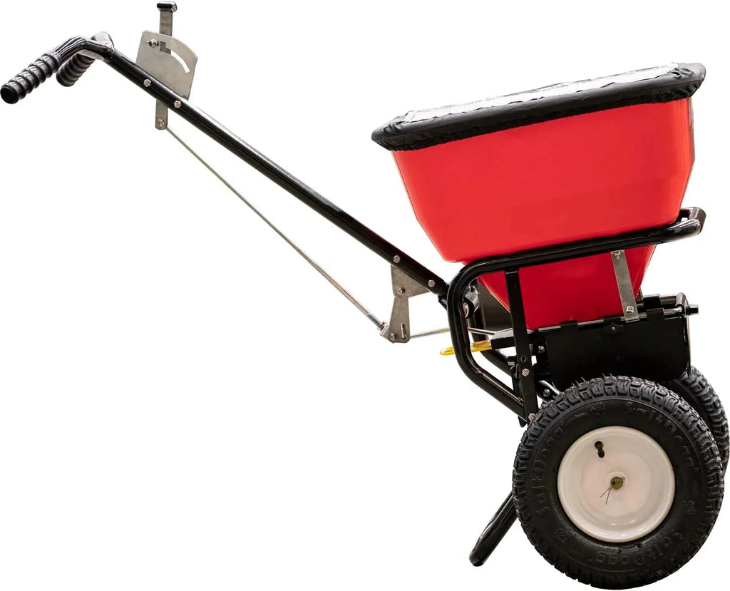 Multi-purpose push-along spreader, 100 lb capacity, versatile tool for lawn seed, salt, de-icer, fertilizer and seeds